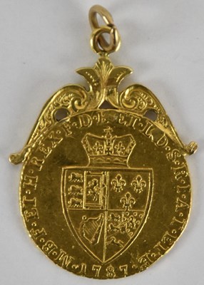 Lot 1387 - A George III 1787 shield back gold guinea,...