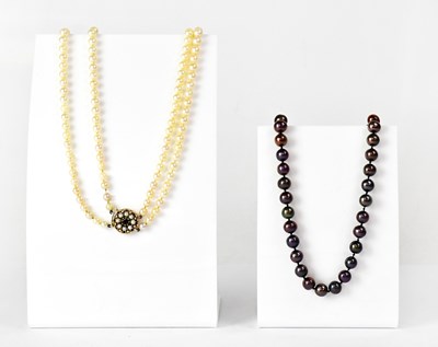 Lot 1087 - A double-strand pearl necklace with a 9ct...