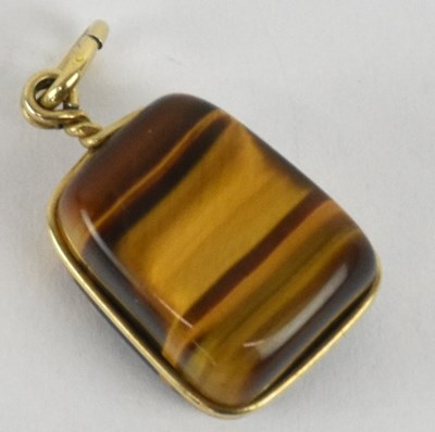 Lot 1225 - A yellow metal mounted banded agate pendant,...