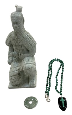 Lot 643 - A modern Chinese carved green hardstone figure...