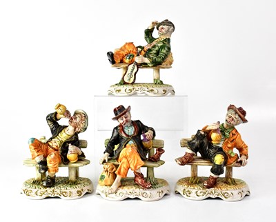 Lot 204 - CAPODIMONTE; four figures of old men seated on...