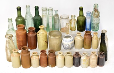 Lot 350 - A large quantity of ceramic and glass bottles...