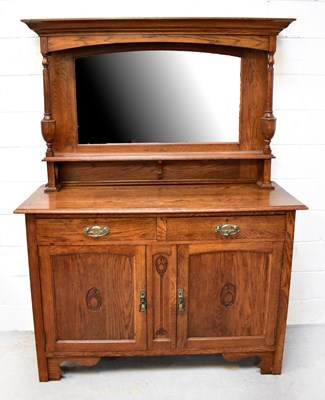 Lot 73 - An early 20th century oak Arts and Crafts...