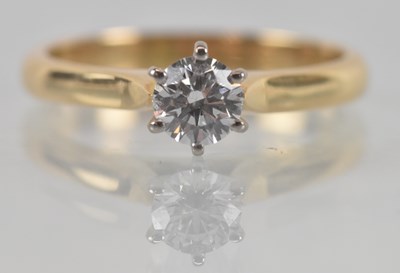 Lot 1105 - An 18ct yellow gold diamond solitaire ring,...