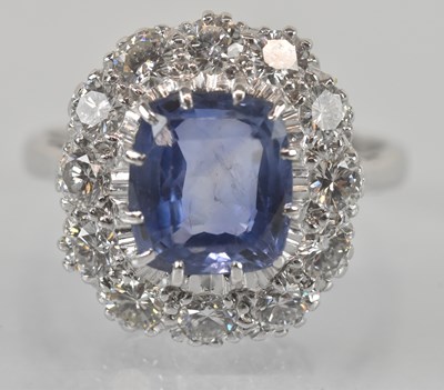 Lot 1101 - An 18ct white gold sapphire and diamond set...