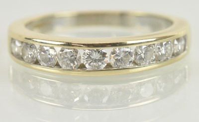 Lot 1114 - An 18ct yellow gold nine stone diamond set...