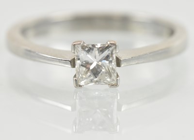 Lot 1113 - An 18ct white gold diamond solitaire ring, the...