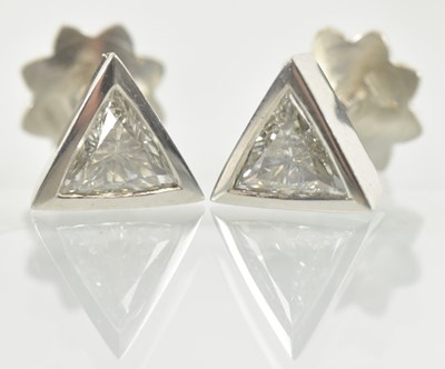 Lot 1236 - A pair of platinum trillion cut diamond ear...