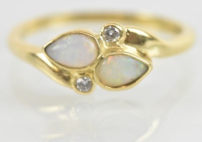 Lot 1162 - An 18ct yellow gold opal and diamond set...