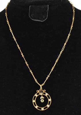 Lot 1210 - A 9ct yellow gold peridot and seed pearl set...