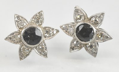 Lot 1246 - A pair of white metal sapphire and diamond set...