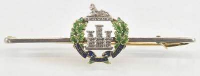 Lot 1271 - A yellow metal Essex Regiment blue and green...