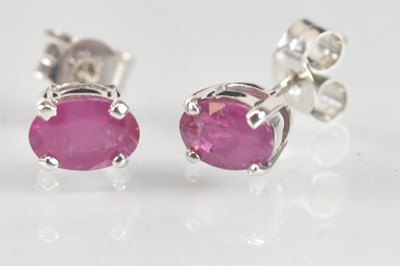 Lot 1249 - A pair of 9ct white gold ruby set ear studs,...
