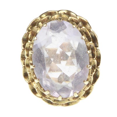 Lot 1043 - A 9ct gold dress ring with oval cut claw set...