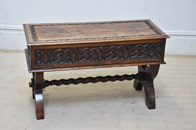 Lot 2206 - A carved oak coffee table with Celtic knot...