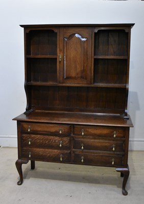 Lot 2196 - An early 20th century oak dresser, the boarded...