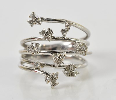Lot 82 - An 18ct white gold diamond set ring of open...