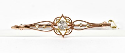 Lot 1065 - A 9ct rose gold bar brooch set with a central...