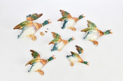 Lot 1557 - BESWICK; a set of six flying mallards (part...