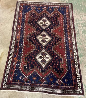 Lot 681 - An Afshar rug with three central medallions....