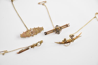 Lot 267 - Four Edwardian 9ct yellow gold brooches, three...