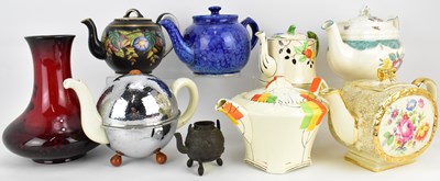Lot 382 - Ceramics to include seven decorative teapots,...