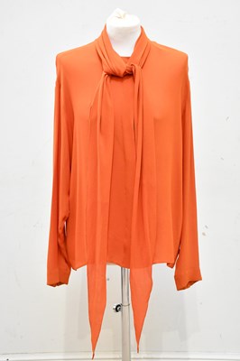 Lot 728 - HERMÈS; a 100% silk orange blouse, with tie...