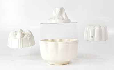 Lot 239 - SHELLEY; two white ceramic jelly moulds and...