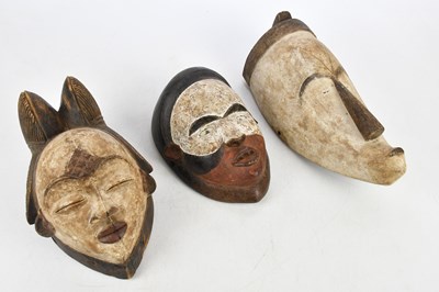 Lot 1834 - A group of three African tribal masks...