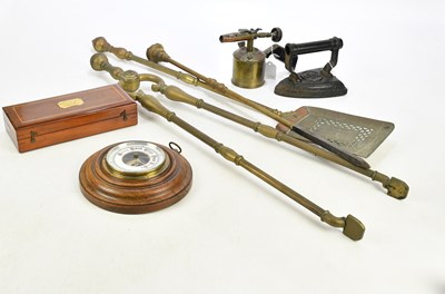 Lot 2335 - A three piece brass companion set, a circular...
