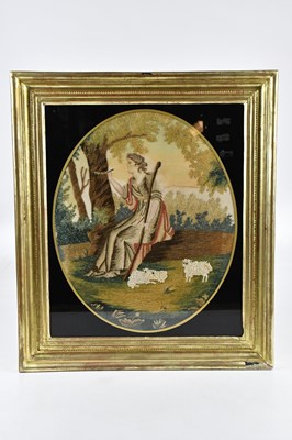 Lot 1373 - An early 19th century needlework on silk panel,...