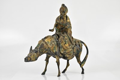 Lot 54 - A Chinese bronze model of an elder on...