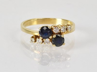 Lot 763 - An 18ct yellow gold ring set with a pair of...