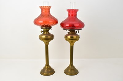 Lot 131 - A near pair of 19th century oil lamps, the...