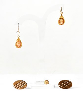 Lot 1104 - A pair of 9ct yellow gold oval cufflinks (one...
