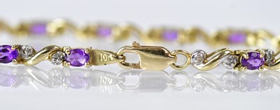 Lot 1055 - A 10ct yellow gold bracelet set with amethysts...