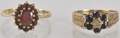 Lot 1308 - A 9ct gold garnet cluster ring, with central...