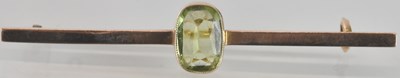 Lot 1561 - A 9ct gold bar brooch, with cushion cut bezel...
