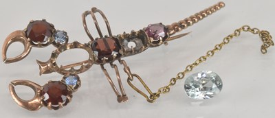 Lot 1550 - A rose gold brooch in the form of a gem set...