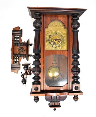 Lot 183 - A 19th century Vienna-style wall clock in an...