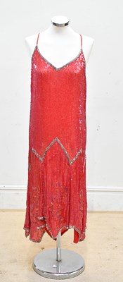 Lot 729 - An original 1920s red knee length silk crepe...