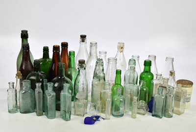 Lot 2317 - A collection of glass medicine bottles, beer...