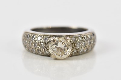 Lot 51 - A white metal and diamond dress ring, the four...
