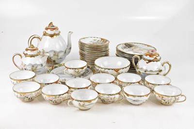 Lot 1675 - A Japanese eggshell porcelain part tea/dinner...