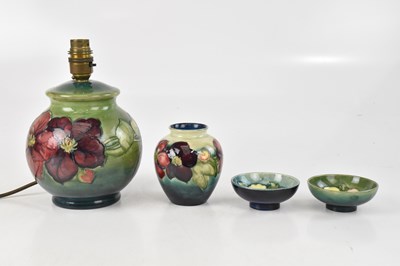 Lot 1707 - MOORCROFT; a bulbous table lamp decorated in...