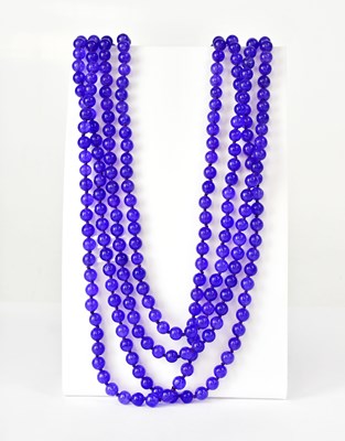 Lot 1094 - A long violet tanzanite continuous...