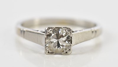 Lot 83 - A platinum and diamond solitaire ring, the...