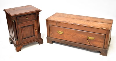 Lot 86 - A single-drawer coffee table with brass swing...