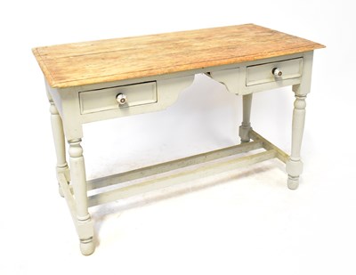 Lot 77 - A painted pine two-drawer desk in the rustic...