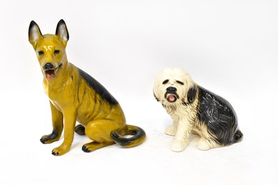 Lot 218 - Two floor-standing ceramic dogs, an Alsatian,...
